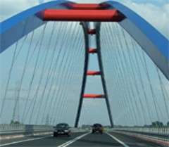 Cars passing a bridge