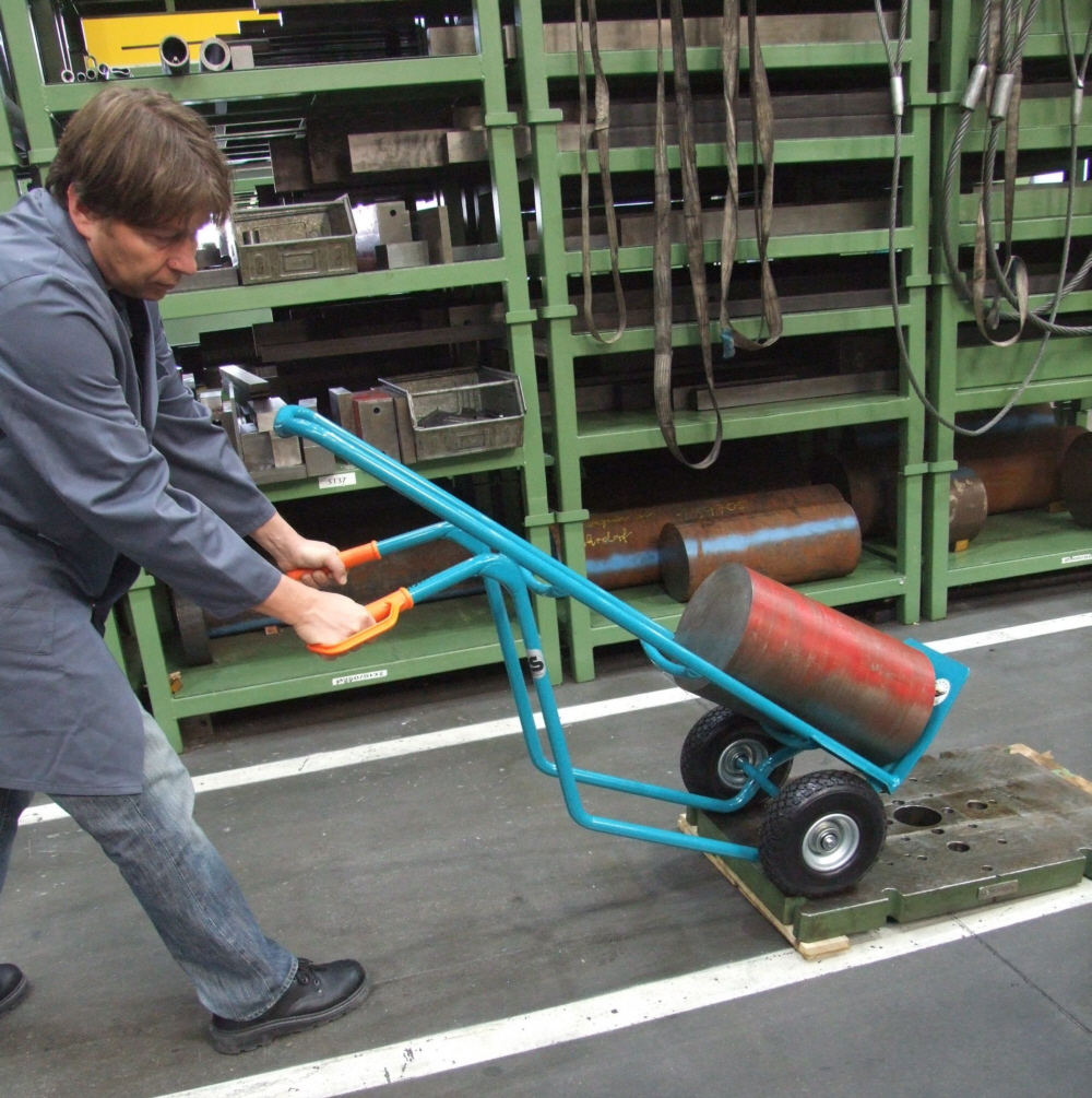 Employee testing a hand-operated industrial truck