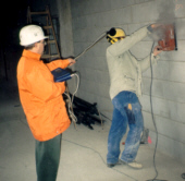 Investigating noise-reducing grinder disks in a sound-absorbing measuring room