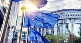 photo of EU flags in front of the European Parliament in Brussels